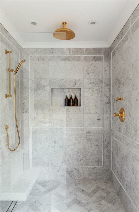 Shower Niche In Marble Shower With Brass Plumbing Fixtures Room For