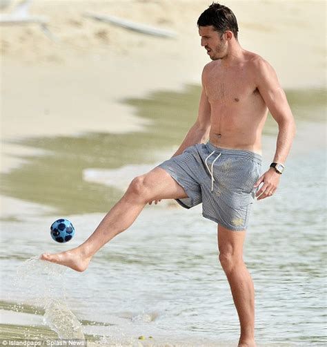 phil neville and michael carrick keep in shape with a quick game of football during holiday in