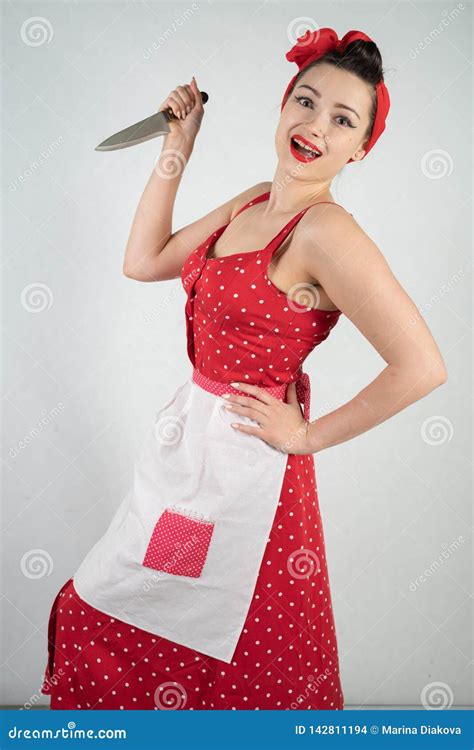 Dangerous Pin Up Girl Housewife In Red Vintage Polka Dot Dress Stands