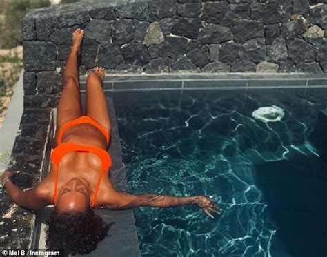 Mel B Puts On A Very Busty Display In A Bright Orange Bikini As She Soaks Up The Sun During