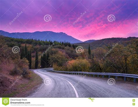 Mountain Winding Road Passing Through The Forest With Dramatic Colorful