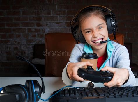 Girl Sitting In Front Of Monitor With Video Game With Sad Face Stock