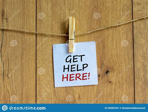 Get Help Here Symbol Wooden Clothespin With White Sheet Of Paper