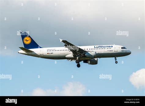 Side View Of A Lufthansa Airbus A320 Aircraft On Approach To Land At