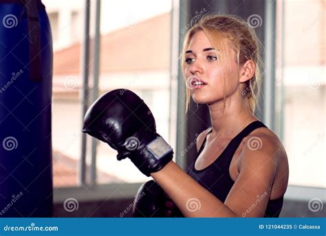 Attractive Female Punching A Bag With Boxing Glove Stock Image Image
