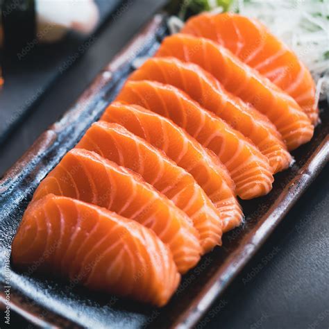 Salmon Sashimi In Japanese Buffet Restaurant Menu Fresh Salmon Fillet On Black Plate Salmon