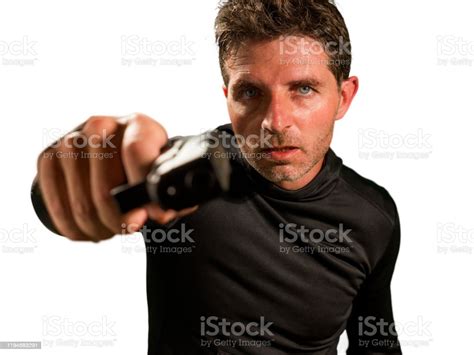 Action Portrait Of Angry And Attractive Hitman Or Special Agent Man