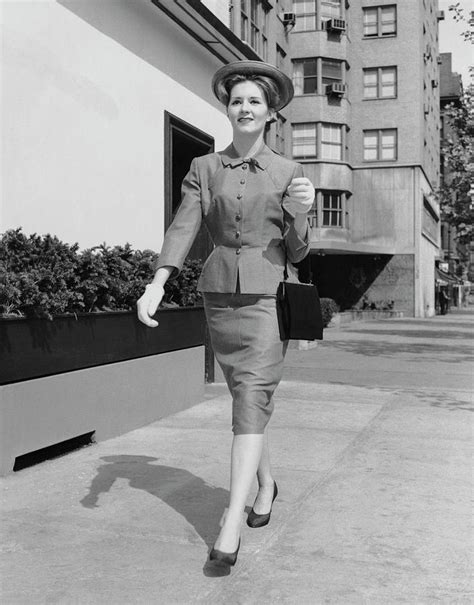 Woman Walking Down Sidewalk By George Marks