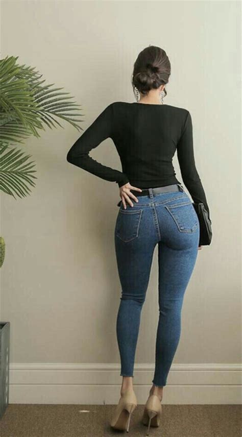 Who Is The Babe With A Nice Ass In Skin Tight Blue Jeans Standing Beside A Fern 1049463