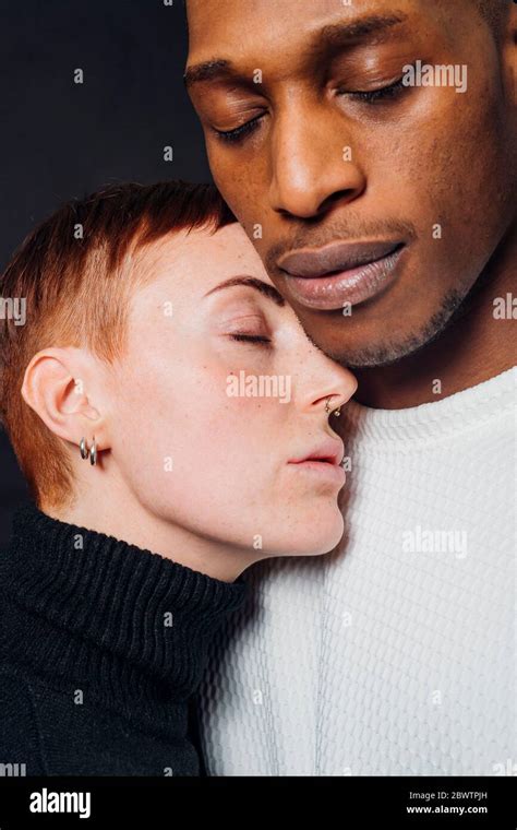Studio Portrait Of Affectionate Mixed Race Couple Stock Photo Alamy