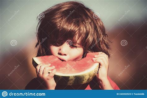 Close Up Portrait Of Cute Little Child Eating Sweet Watermelon
