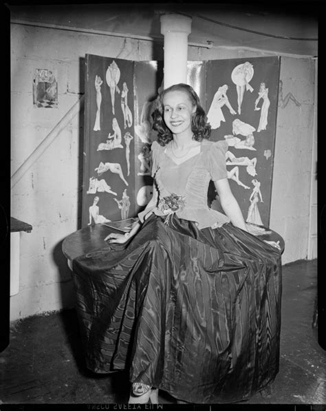 Portrait Of Vivian Davidson Wearing Gown With Ruffled Waist And Moire Skirt Posed In Front Of