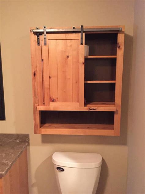 In looking at your pictures i can see that your medicine cabinet was installed before the tile work was done. Rustic Sliding Barn Door Cabinet | Rustic medicine ...