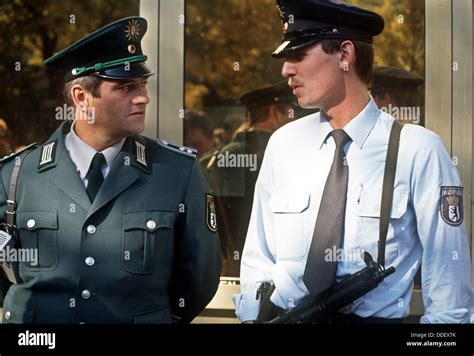 Police Officers Of West R And East L Berlin Chat At The German