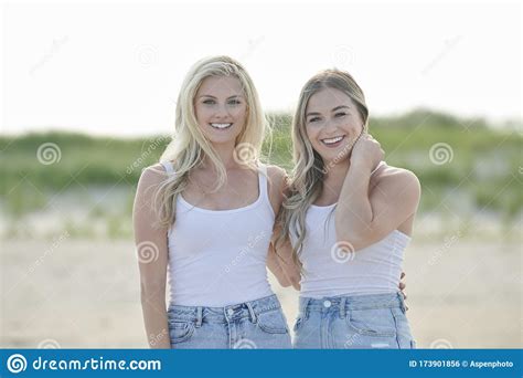 Beautiful Female Friends Spend Time At The Beach Stock Photo Image Of