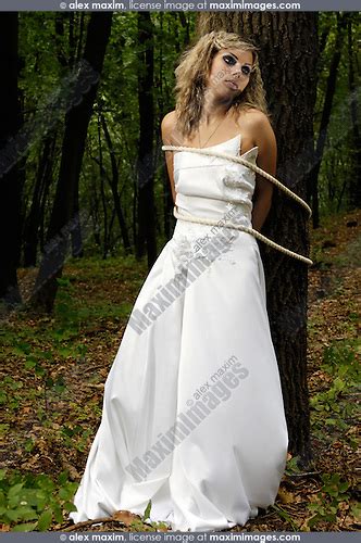 Bride Tied To A Tree In A Forest Fashion Commercial Fine Art Stock Photo Archive