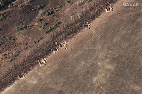 Satellite Images Show Russia Building Defenses To Protect Military