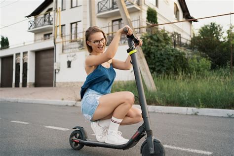 Free Photo Young Beautiful Girl Riding An Electric Scooter In The