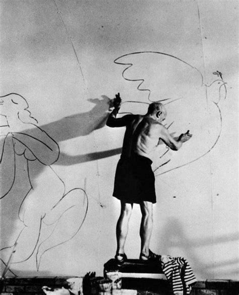Pablo Picasso Drawing A Dove Of Peace On A Wall In His Studio 1955