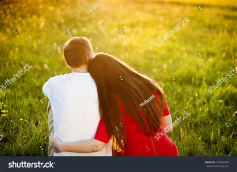Happy Couple Sitting Grass Watching Sunset Stock Photo 138469349
