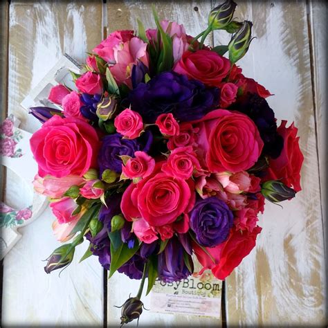 hot pink and purple bridal bouquet stunning roses lisianthus gentian and alstromeria make up