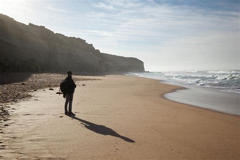 Lonely Man On Australian Beach In The Photograph by Matteo Colombo