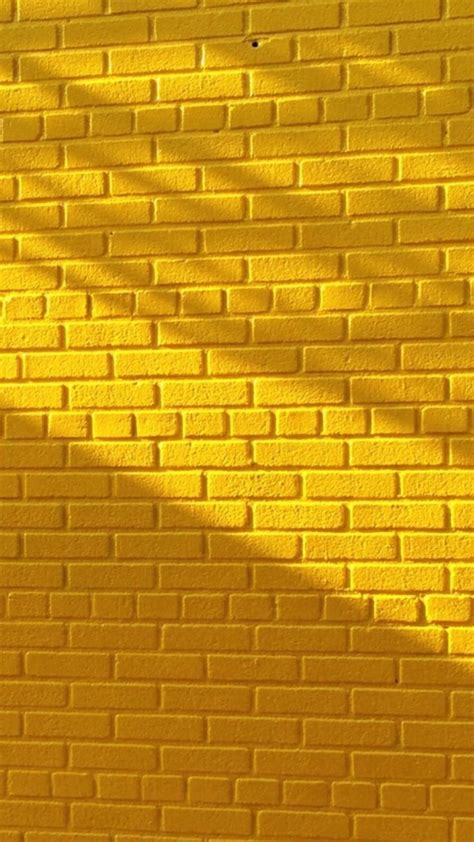 Yellow Brick Wall With Beautiful Lighting O Papel De Parede Amarelo