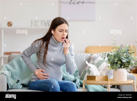 Coughing Pregnant Woman At Home Stock Photo Alamy