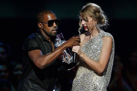 kanye west storms the vmas stage during taylor swift s speech rolling stone