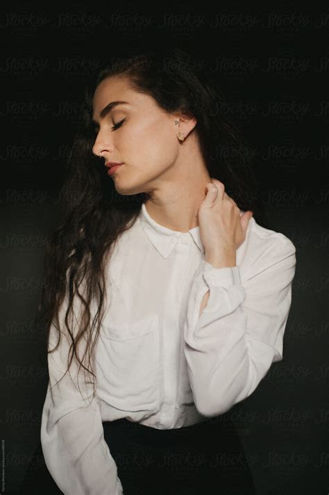 Pretty Woman In White Button Up Shirt Septum Piercing And Long Dark