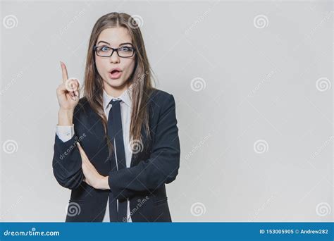 Young Pretty Businesswoman Is Pointing Her Finger Up With An Amusement