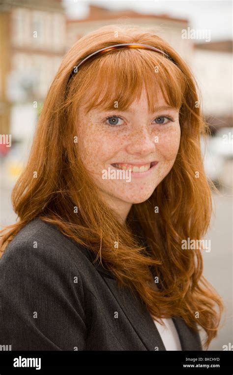Portrait Of A Teenage Girl With Red Hair Blue Eyes And Lots Of Freckles