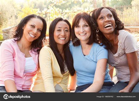 Diverse group of women talking and laughing. Royalty Free ...