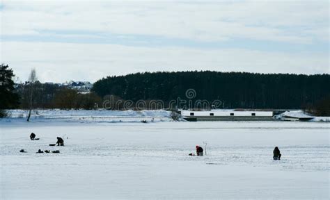 Fishermen Catch Fish On A Frozen Lake In Winter Stock Image Image Of