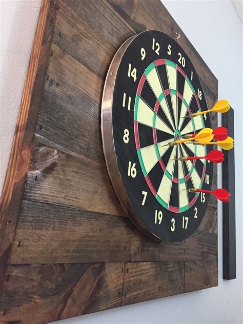 Darts is a classic game that you can find in bars, clubs, and pubs around the world. Related image | Dart board backboard, Dart board wall ...