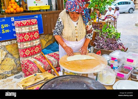 antalya turkey may 6 2017 the elderly cook makes gozleme traditional turkish flat breads