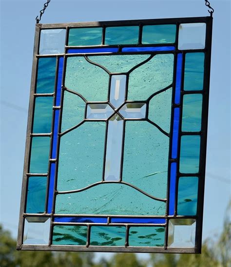 A Stained Glass Window Hanging From A Chain