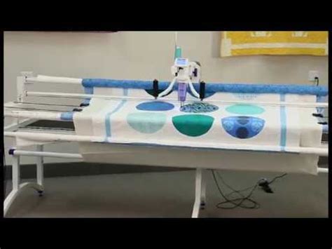 I'd be afraid to attach it to the fabric, but i don't see how it would attach to the grommet ring. How to attach fabric onto JUKI longarm machine - YouTube