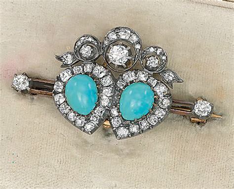 AN ANTIQUE TURQUOISE AND DIAMOND BROOCH AND A GEM SET BANGLE