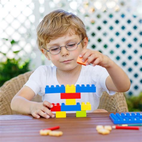 Little Kid Boy Playing With Plastic Blocks Stock Image Image Of