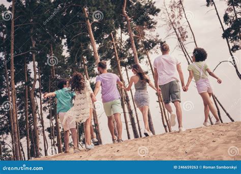 Photo Of Pretty Adorable Young Six Friends Wear Casual Clothes Holding