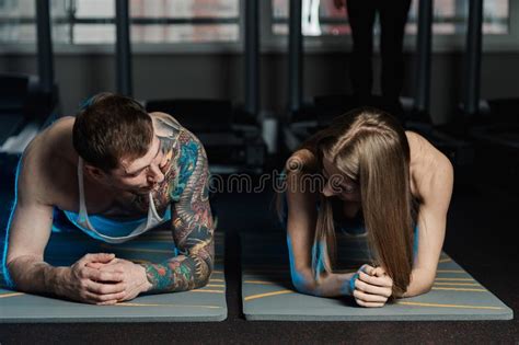 Fit Sportive Man And Woman Doing Plank Core Exercise Training Back And Press Muscles Concept Gym