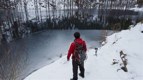 A Guy Standing On The Shore Admires Mountain Lake Stock Image Image