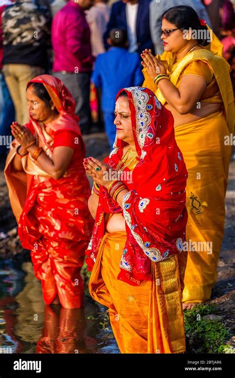 Kathmandunepal November 12019 Hindu Devotees Offering Prayers To Sun God Standing In Water