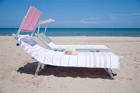 Beautiful And Colorful Sun Beds For Sunbathing On The Beach Stock Photo Image Of Palm Rimini