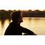 Sad Guy By The River At Sunset Stock Video Footage  Storyblocks