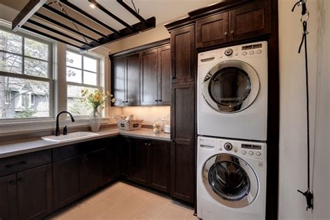 A typical laundry can usually be located besides kitchen in homes. Modern laundry room cabinets and practical storage ...