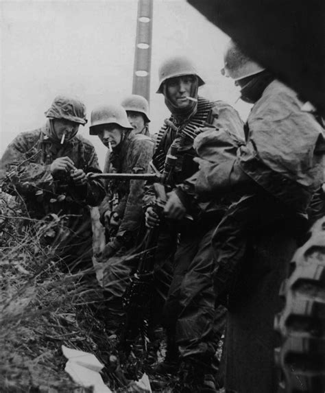 Weary Soldiers Of The Waffen Ss Taking A Brief Pause For A Smoke During