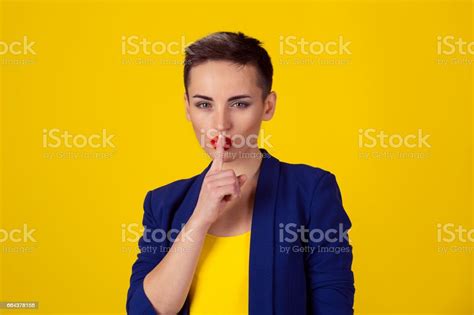 Shh Woman Wide Eyed Asking For Silence Or Secrecy With Finger On Lips