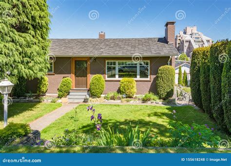 Front Yard Of Residential House Decorated With Flowers On Sunny Day
